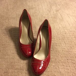 Red patent pumps